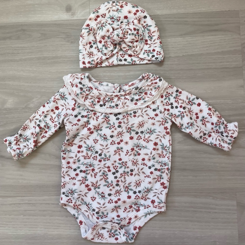 White Floral long sleeve onesie, size 3/6M and a hat with a bow for a baby girl.